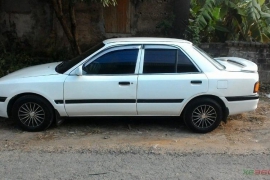 Mazda 323 đời 1995, màu trắng, giá cạnh tranh